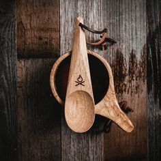 two wooden spoons sitting on top of a bowl