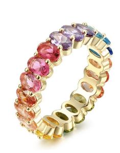 A celebration of color lands in elegant, standout jewelry as this eternity ring displays a rainbow palette and glam style. Multicolored oval crystals encircle a pleated yellow gold setting, enriching the inherent warmth of a classic. Ring is in stock in sizes 5 and 6. Rainbow Palette, Ring Displays, Glam Style, Yellow Gold Setting, Oval Stone, Glam Fashion, Classic Ring, Eternity Ring, Rings Statement