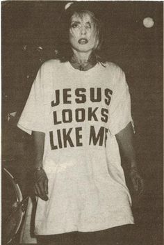 an old black and white photo of a woman wearing a jesus looks like me t - shirt