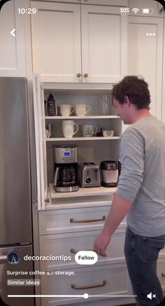 a man standing in front of an open refrigerator