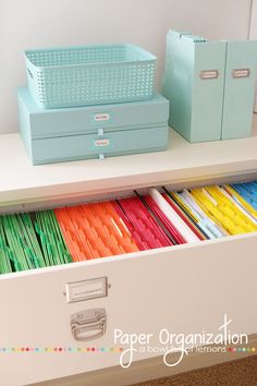 an organized drawer with colored file folders in it and the text get your home super organized