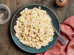 a bowl of macaroni and cheese with a spoon