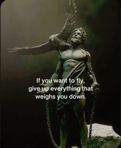 a statue with a quote on it saying if you want to fly, give up everything that weights you down