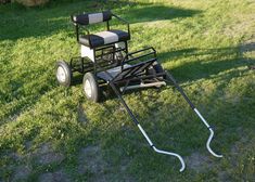 a lawn mower sitting in the grass