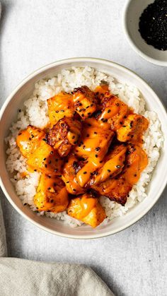 a white bowl filled with chicken and rice