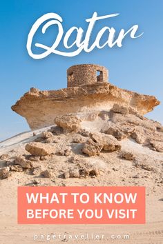 an old castle on top of a hill with the words qatar written over it