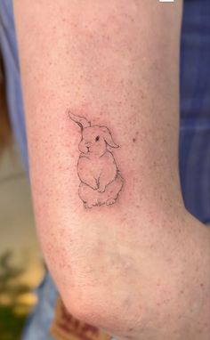 a small rabbit tattoo on the leg