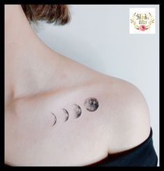 a woman's chest with three phases of the moon on it