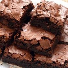 chocolate brownies stacked on top of each other