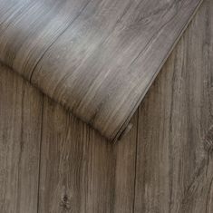 a close up view of the wood grains on this flooring material, which is very dark brown