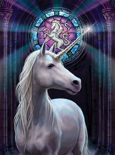 a white unicorn standing in front of a stained glass window