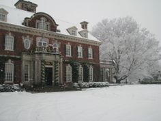 a large red brick building covered in snow