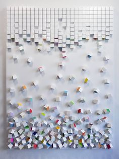 an art piece with many different colored squares on it