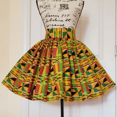 Cute And Flirty African Kente Print High Quality Cotton Skirt High Waist And Gathering All Around And Fully Lined. Available In Any Size. Less Than 22 Inch To 51 Inch Or More. (This Is Your Actual Waist In Inches) Approximately 20 Inches Long. Feel Free To Request Customize Skirt And Send Your Actual Waist And Length Requirements In Inches. Or Select The Size Range Based On Your Actual Waist Measurement Two Good Size Side Pockets This Garment Is Made With Elastic In The Back To Fit Multiple Sizes. It Is Fully Lined For Luxurious Feel And Look. All Colors Available As Well As Varying Prints Based On Background Color (Colors May Vary Due To Availability) ***Please Contact For Avail Ankara Flare Skirt, Kente Print, African Print Skirt, Skirt High Waist, Waist Measurement, Print Skirt, Cotton Skirt, Orange Gold, Flare Skirt