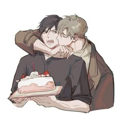 two people hugging each other over a cake