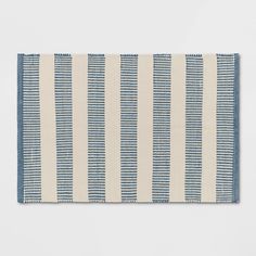 a blue and white rug with horizontal stripes