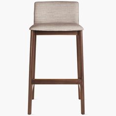 an upholstered bar stool with a wooden frame and fabric seat pad, on a white background