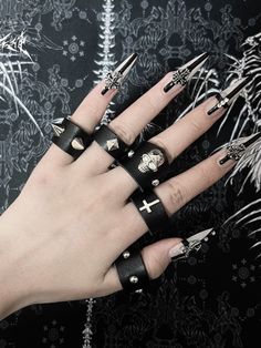 This is a set of five rings, each adorned with unique decorations including studs, skeletons, and crosses.Perfect for those who love a blend of gothic and edgy fashion elements, this ring set adds a bold statement to any outfit. Ideal for both casual wear and special occasions, these rings are versatile and stylish.  The price includes all five rings.  Ring Diameters: - Thumb, Index, and Middle Fingers: 6.5 cm - Ring and Pinky Fingers: 6 cm Emo Rings, Skeleton Rings, Punk Pastel, Emo Jewelry, Xoxo Jewelry, Five Rings, Skeleton Ring, Neon Nail Designs, Middle Fingers