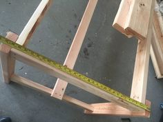 the wooden frame is being built and ready to be used as a bench or table