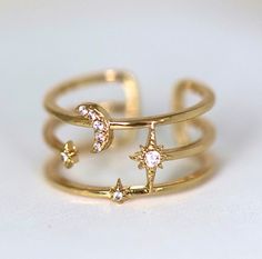 Product details: 18k gold filled adjustable to fit most ring sizes cubic zirconia moon and star detail Sun Moon And Stars Jewelry, Adjustable Rings Gold, Star Rings Jewelry, Star And Moon Jewelry, Moon And Star Rings, Clouds Jewelry, Gold Star Jewelry, Moon And Star Jewelry, Moon Star Ring