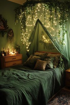 a bedroom decorated in green with fairy lights