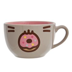 a coffee cup with a donut drawn on the inside of it's face