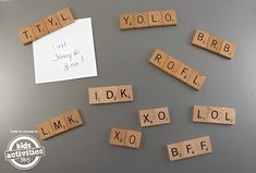 scrabbled wooden letters spelling out the names of different languages on a gray surface