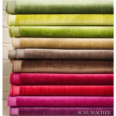 a stack of different colored linens on top of each other with the words schmaacher