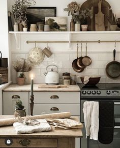 a kitchen filled with lots of pots and pans