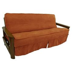 an orange futon sofa with wooden frame