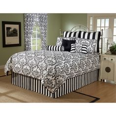 a black and white bed in a bedroom