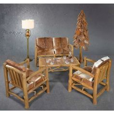 a living room filled with furniture and a christmas tree on top of a wooden table