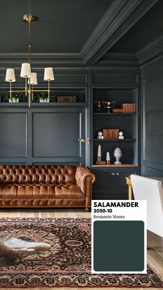 a living room with blue walls and leather furniture