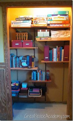 a bookshelf filled with lots of books in a room