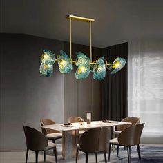 a dining room table with chairs and a chandelier hanging from it's ceiling