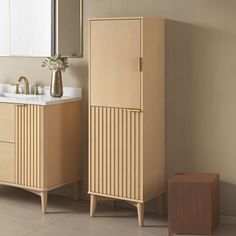 a bathroom with two sinks and a wooden cabinet