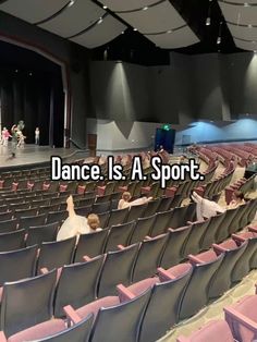 an auditorium filled with lots of empty chairs