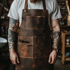 Introducing our Custom Barber Apron: where style meets individuality in the world of grooming. Crafted with meticulous attention to detail, our apron offers a personalized touch to your barbering experience. Bbq Truck, Leather Aprons, Workwear Men, Bar Apron, Welding Apron, Pocket Placement, Barista Apron, Barber Apron, Craft Apron