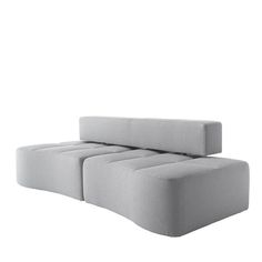 a gray couch sitting on top of a white floor