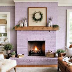 a living room filled with furniture and a fire place under a painting on the wall