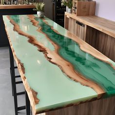 a counter top with green and brown paint on it in a store or office area