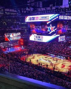 a basketball game is being played in an arena