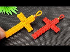 two crocheted crosses are being held together