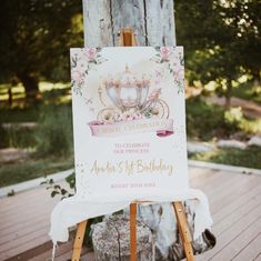 an easel with a sign on it that says happy birthday to the queen and prince