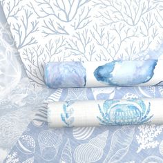 two blue and white wallpapers with seaweed designs on them, next to each other