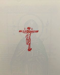 a red and white drawing of a person on a crucifix with the words jesus above it