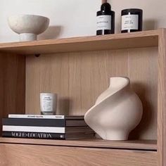 a shelf with some books and bottles on it