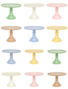 an assortment of different colored pedestals on a white background