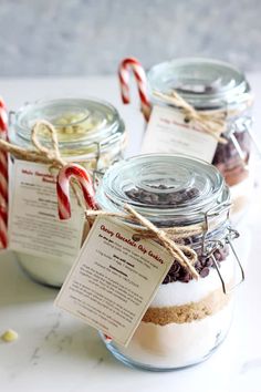 brownies and cookies in jars with candy canes