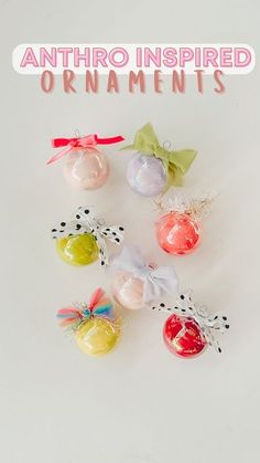 an assortment of christmas ornaments on a white background with the words anthro inspired ornaments